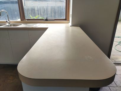 Before: beige laminate peninsula
